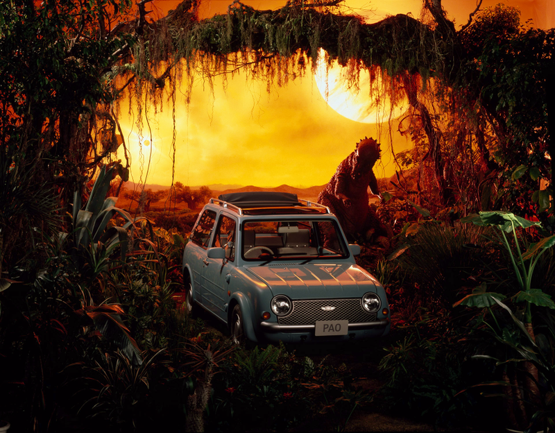 Illustration for article titled The Nissan Pao's Press Pics Have Dinosaurs, Are The Greatest Ever